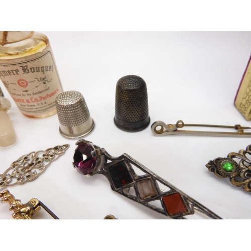 902 - Vintage perfume bottles, a gold plated manicure set, and a quantity of costume jewellery to include ... 