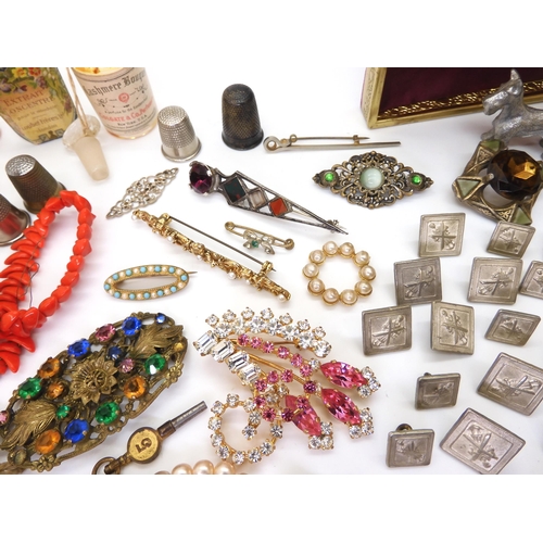 902 - Vintage perfume bottles, a gold plated manicure set, and a quantity of costume jewellery to include ... 