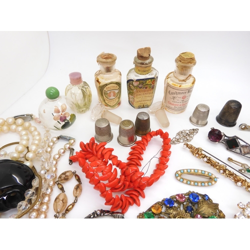 902 - Vintage perfume bottles, a gold plated manicure set, and a quantity of costume jewellery to include ... 