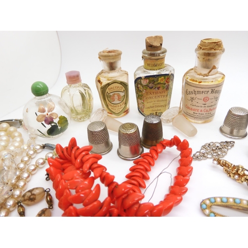 902 - Vintage perfume bottles, a gold plated manicure set, and a quantity of costume jewellery to include ... 