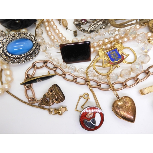 902 - Vintage perfume bottles, a gold plated manicure set, and a quantity of costume jewellery to include ... 