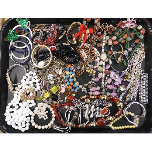 913 - A large collection of vintage brooches, earrings bangles and beads