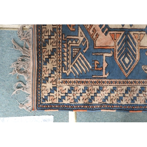 102 - A blue ground Tibetan Kangri rug with all over geometric design and multicoloured border, 175cm long... 