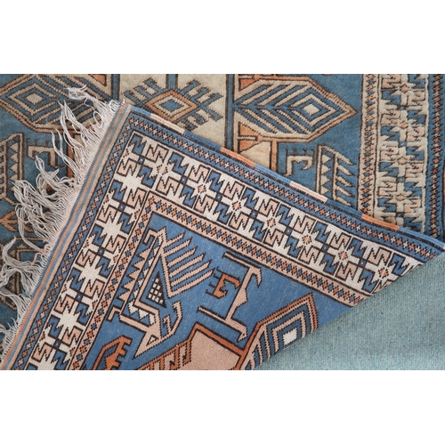 102 - A blue ground Tibetan Kangri rug with all over geometric design and multicoloured border, 175cm long... 