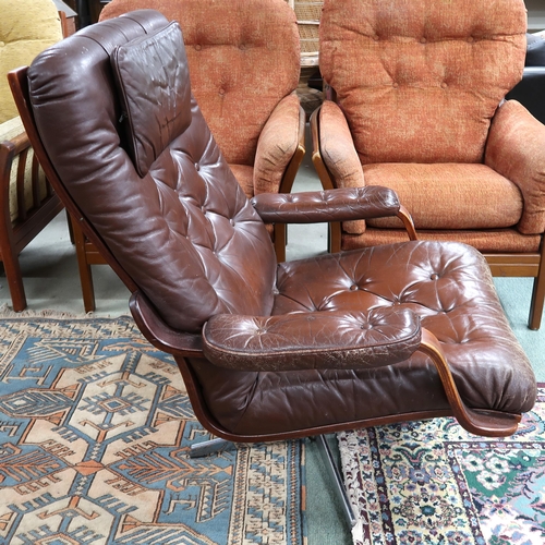 103 - A mid 20th century brown leather button backed upholstered swivel armchair on steel base, 92cm high ... 