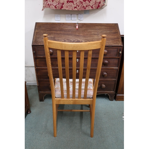 109A - A contemporary Ercol elm and beech dining suite comprising extending dining table, 74cm high x 151cm... 