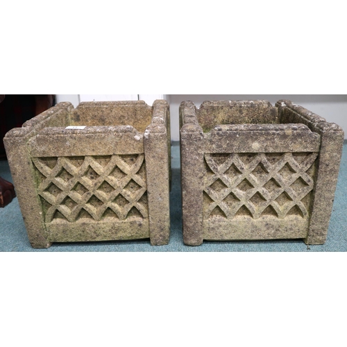 11 - A pair of 20th century reconstituted stone garden planters with gothic grid design to sides, 29cm hi... 