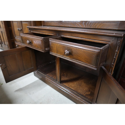 115 - A 20th century Ercol elm and beech bureau bookcase with pair of glazed doors over fall front compart... 