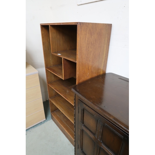 120 - A 20th century Wylie Lochhead ltd oak open bookcase with two asymmetrical shelves over three regular... 