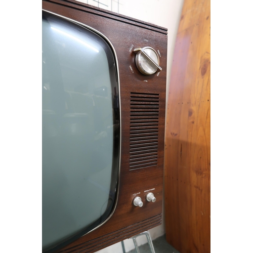 127 - A mid 20th century Ekco television, 84cm high x 68cm wide x 36cm deep, leather travel case and a Gla... 