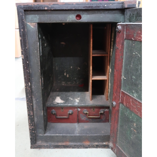 128 - A Victorian cast iron Withers patent fire resisting safe with fitted interior with two drawers (thou... 