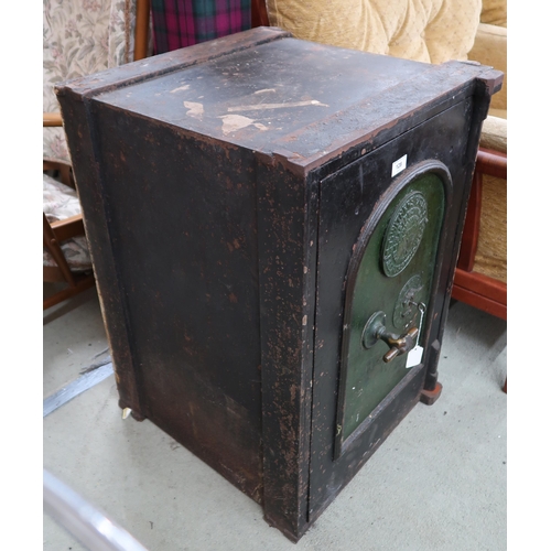 128 - A Victorian cast iron Withers patent fire resisting safe with fitted interior with two drawers (thou... 