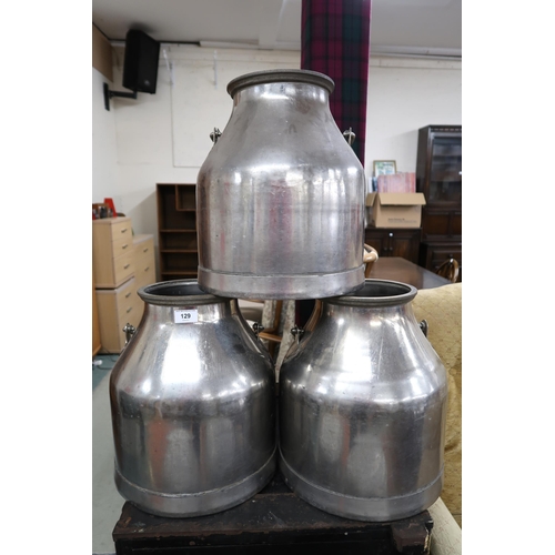 129 - A pair of aluminium W Kerr Lennox Kilbirnie milk cannisters, 69cm high and three smaller stainless s... 