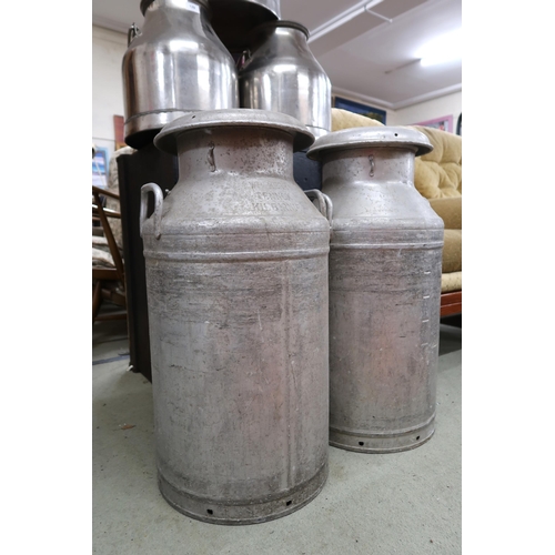 129 - A pair of aluminium W Kerr Lennox Kilbirnie milk cannisters, 69cm high and three smaller stainless s... 