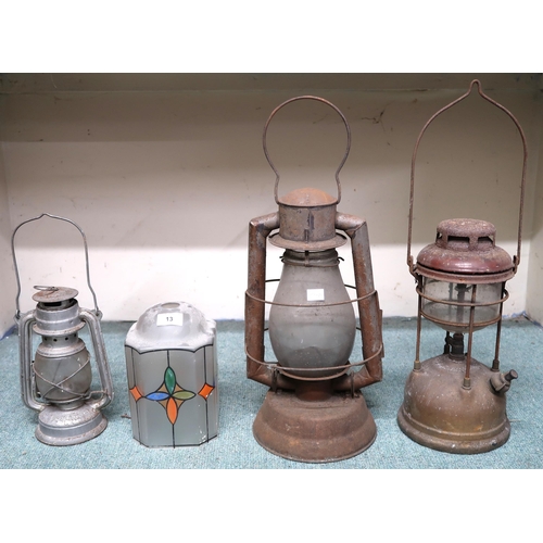 13 - A lot of three assorted Tilley style storm lanterns and a glass light shade (4)