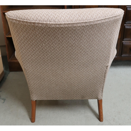 131 - A mid 20th century grey upholstered armchair on shaped teak supports, 79cm high x 70cm wide x 80cm d... 