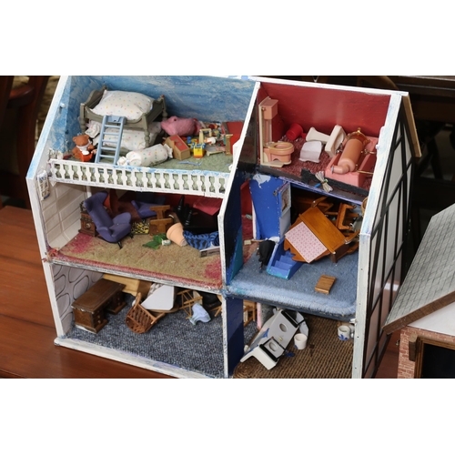 133 - A lot of two assorted dolls houses with assorted contents