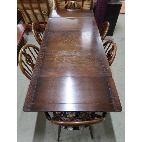 134 - A mid 20th century Ercol elm and beech extending dining table, 75cm high x 115cm long(175cm extended... 