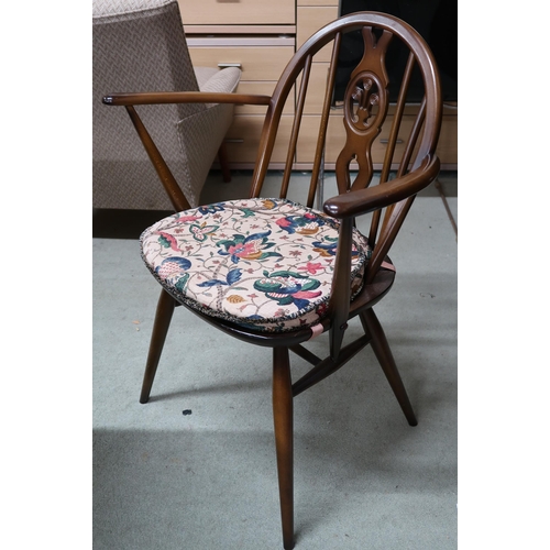 134 - A mid 20th century Ercol elm and beech extending dining table, 75cm high x 115cm long(175cm extended... 