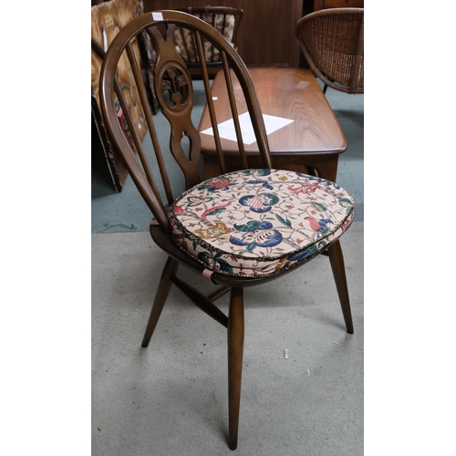 134 - A mid 20th century Ercol elm and beech extending dining table, 75cm high x 115cm long(175cm extended... 