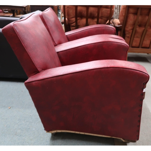 138 - A pair of early 20th century art deco red Rexine upholstered club armchairs, 80cm high x 74cm wide x... 