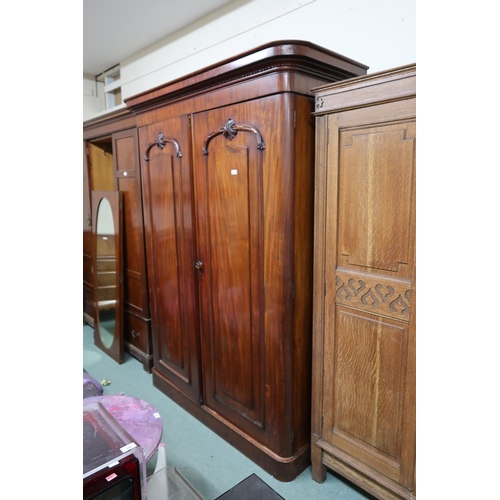 144 - A Victorian mahogany two door wardrobe with fitted interior, 211cm high x 156cm wide x 64cm deep