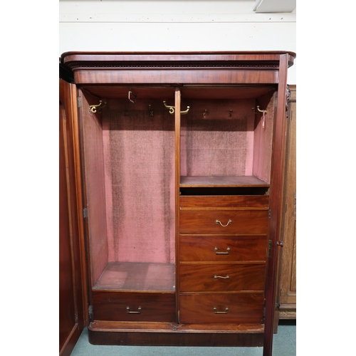 144 - A Victorian mahogany two door wardrobe with fitted interior, 211cm high x 156cm wide x 64cm deep