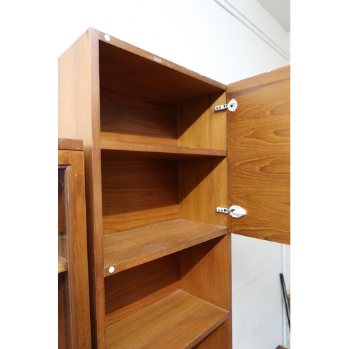 151 - A mid 20th century teak media unit with single cabinet door over three open shelves on base with fal... 