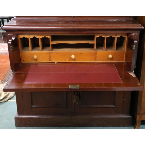 162 - A Victorian mahogany secretaire bookcase with moulded cornice over pair of glazed doors over fitted ... 