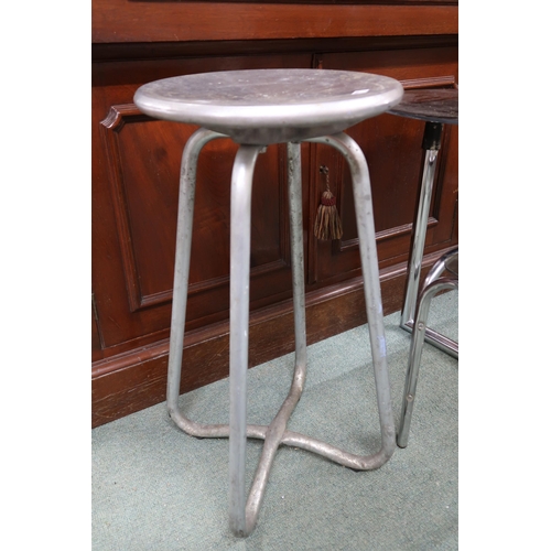 171 - A mid 20th century cast metal stool, circular glass top occasional table and another glass top table... 