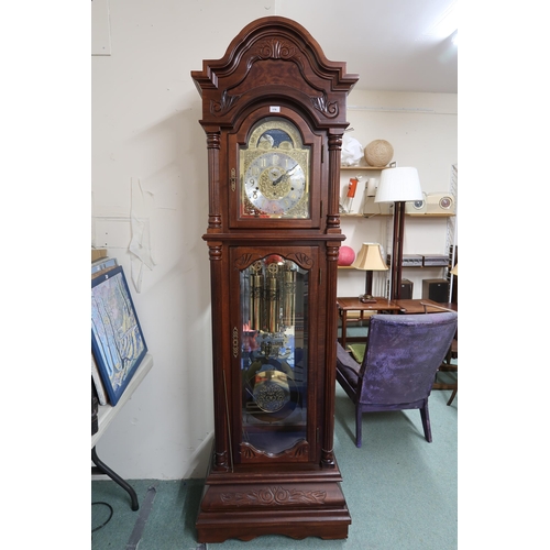 176 - A 20th century mahogany cased longcase clock with arched brass and silvered dial bearing Arabic nume... 