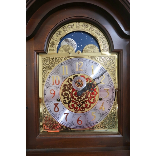 176 - A 20th century mahogany cased longcase clock with arched brass and silvered dial bearing Arabic nume... 