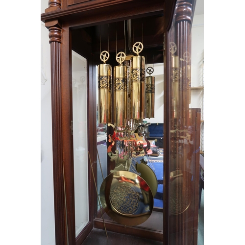 176 - A 20th century mahogany cased longcase clock with arched brass and silvered dial bearing Arabic nume... 