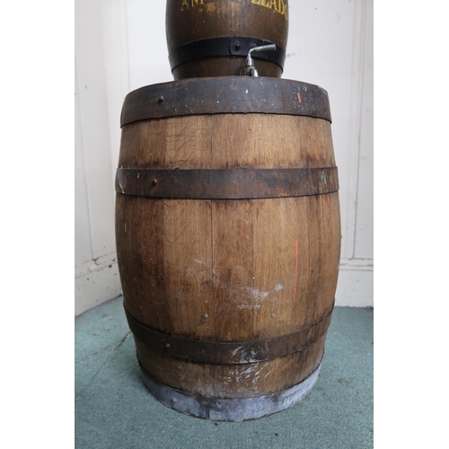 26 - An ironed banded coopered barrel, a smaller coopered wine cask with spigot and a small brass banded ... 
