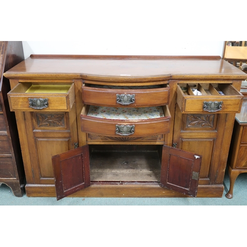 35 - A late Victorian mahogany art nouveau style sideboard with two central bow front drawers over pair o... 