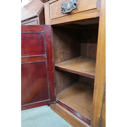 35 - A late Victorian mahogany art nouveau style sideboard with two central bow front drawers over pair o... 