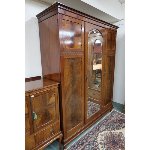36 - An early 20th century mahogany three piece bedroom suite comprising three doored wardrobe, 198cm hig... 