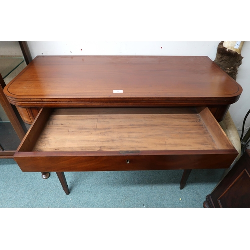 4 - A Victorian mahogany single drawer fold over tea table on square tapering supports, 73cm high x 102c... 