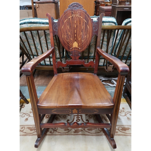 46 - A 20th century mahogany and satinwood inlaid rocking chair
