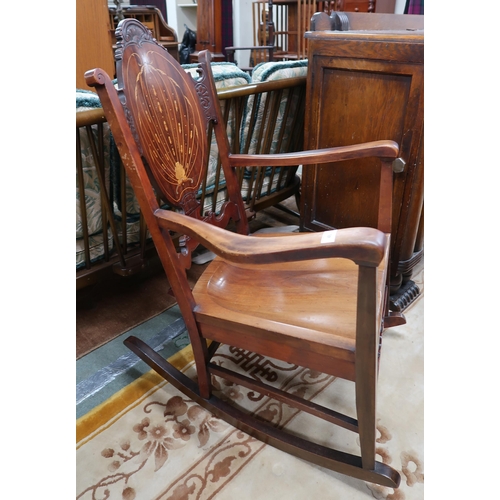 46 - A 20th century mahogany and satinwood inlaid rocking chair