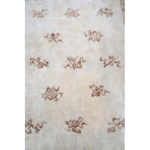 48 - A cream ground Oriental style rug with mustard edged floral borders, 320cm long x 245cm wide