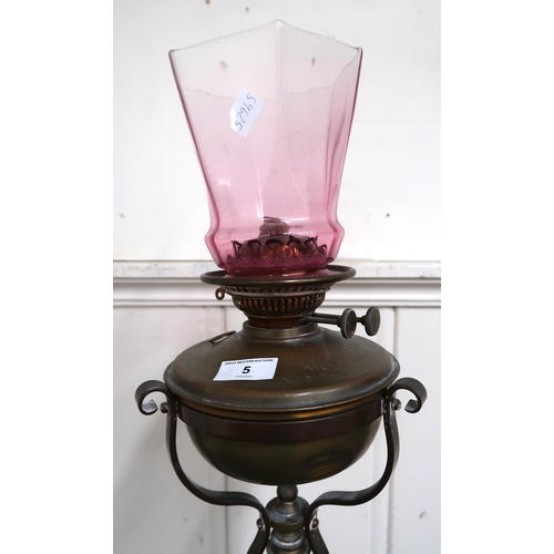 5 - A 19th century brass adjustable oil standard lamp on tripod base, 158cm high