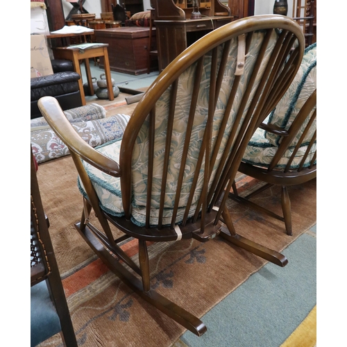 54 - A mid 20th century Ercol elm and beech framed three piece suite comprising three seater settee, 78cm... 