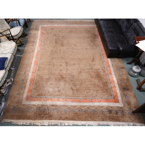 56 - A light brown ground rug with blue and terracotta border, 397cm long x 297cm wide