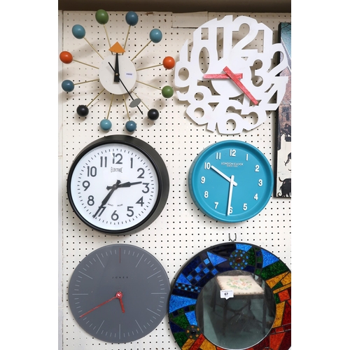 67 - A large mixed lot to include assorted retro wall clocks, wall mirrors etc