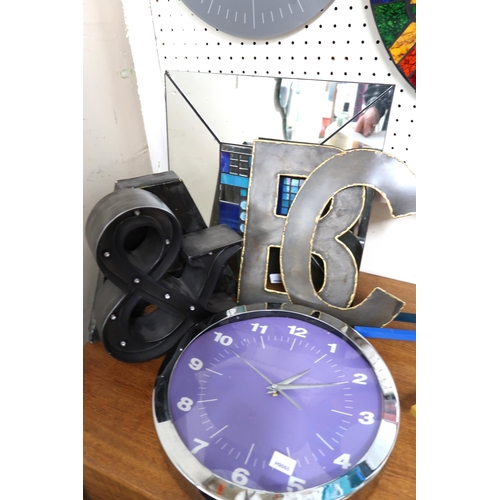 67 - A large mixed lot to include assorted retro wall clocks, wall mirrors etc