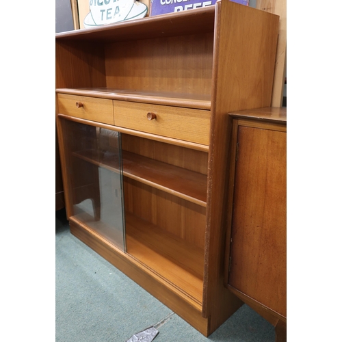 83 - A mid 20th century teak bookcase with open shelf over two drawers over glass sliding doors, 108cm hi... 