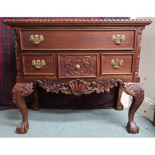 9 - A 20th century mahogany lowboy style chest of drawers with one long over three short drawers on ball... 