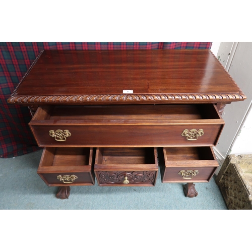 9 - A 20th century mahogany lowboy style chest of drawers with one long over three short drawers on ball... 