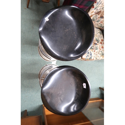 90 - A pair of 20th century revolving bar stools on steel bases (2)